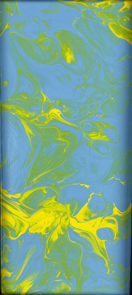 A blue and yellow background with swirls of paint.