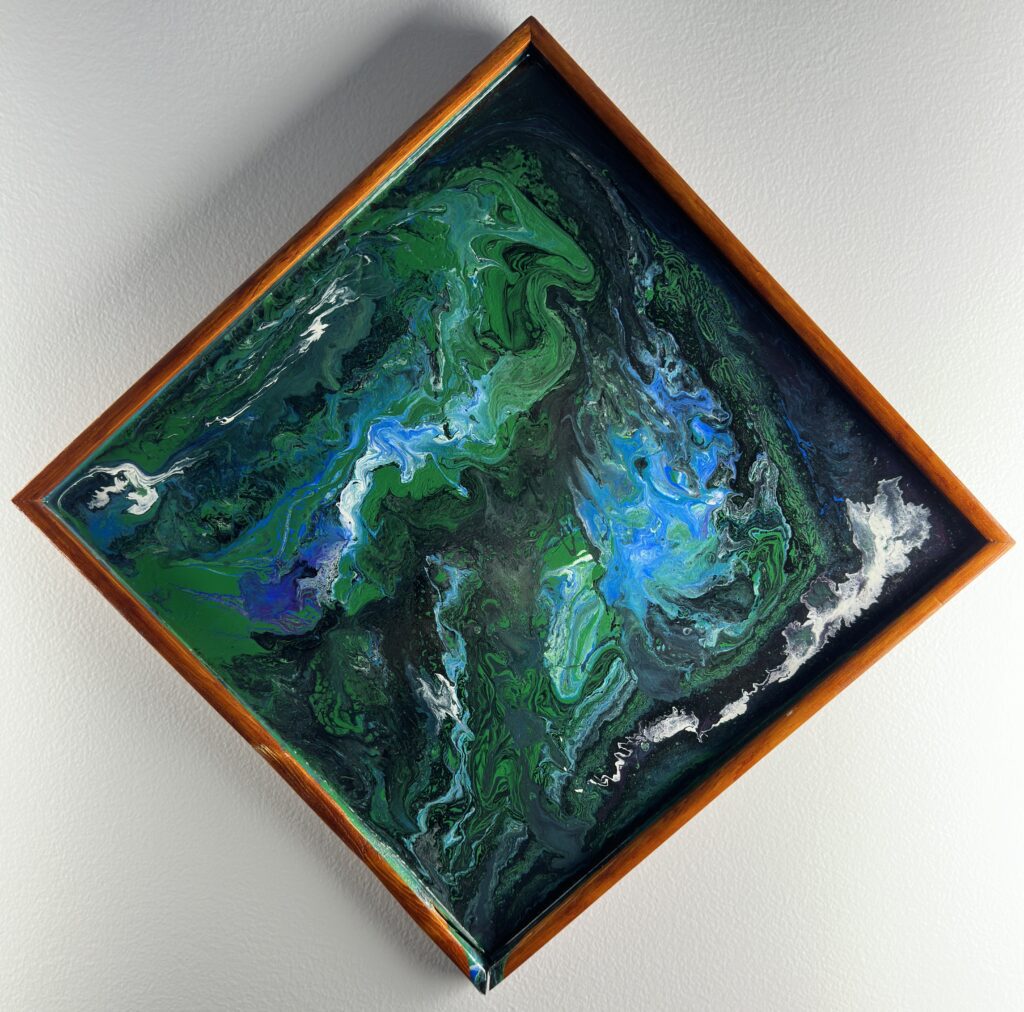 A painting of green and blue water on top of a wooden frame.