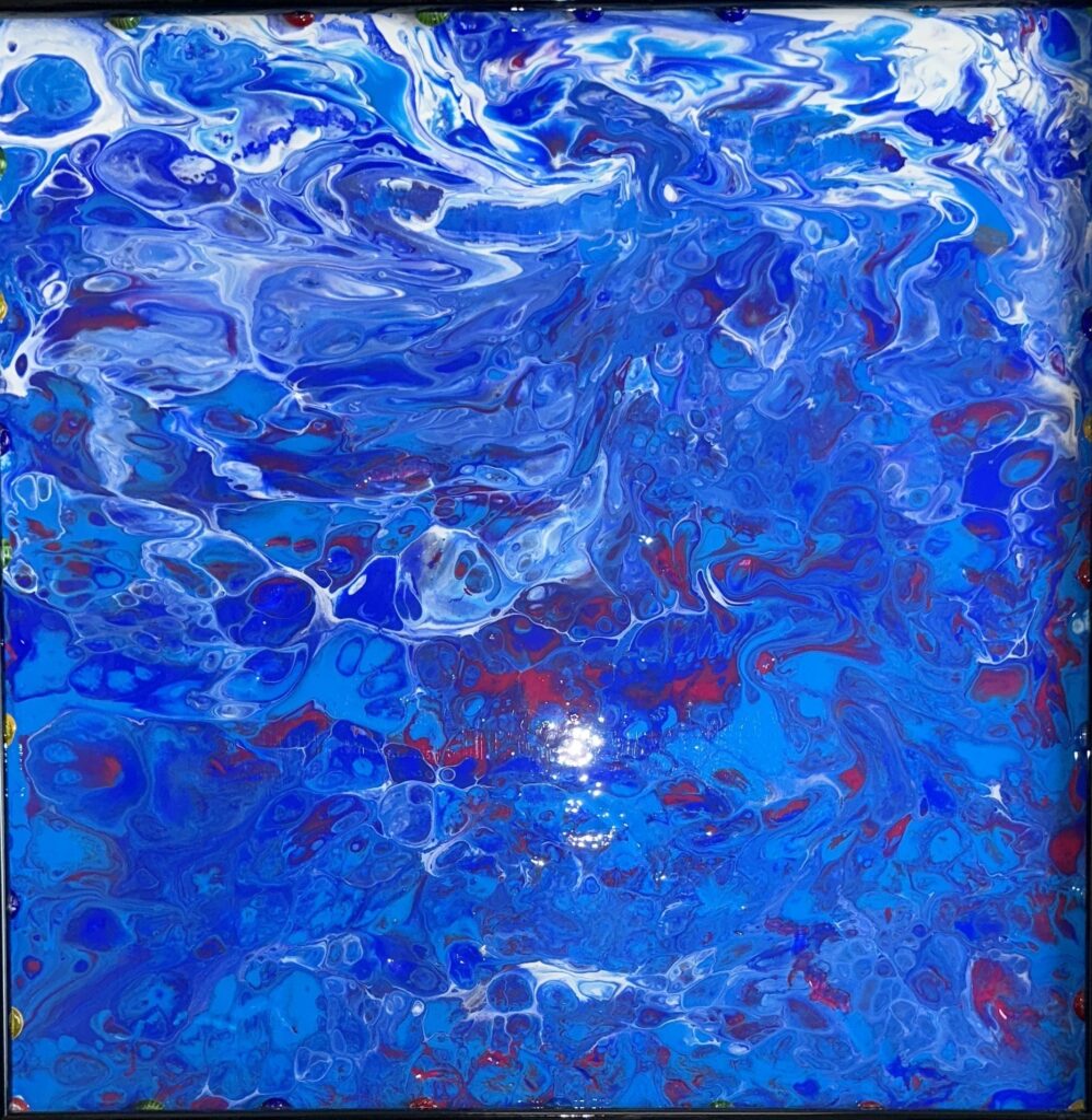 A painting of blue water with red and white swirls.