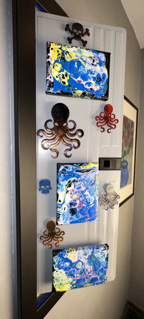 A white door with some octopus decorations on it